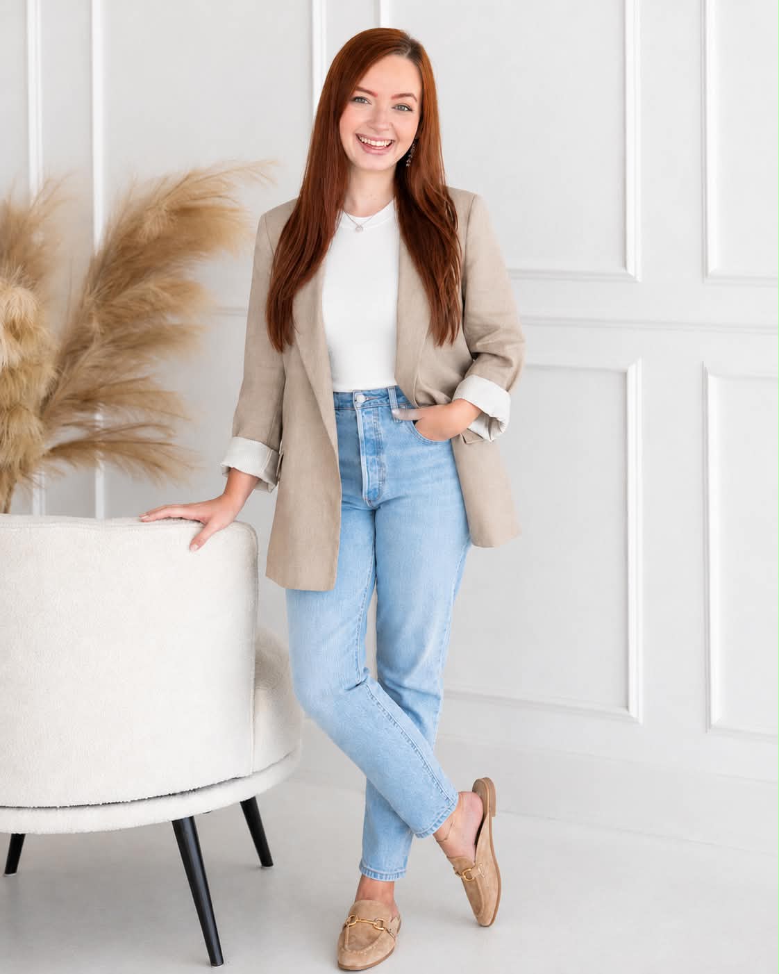 Coach standing in casual blazer and jeans